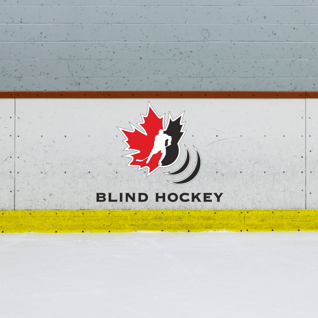 Canadian blind hockey logo placed on the hockey boards by the bench