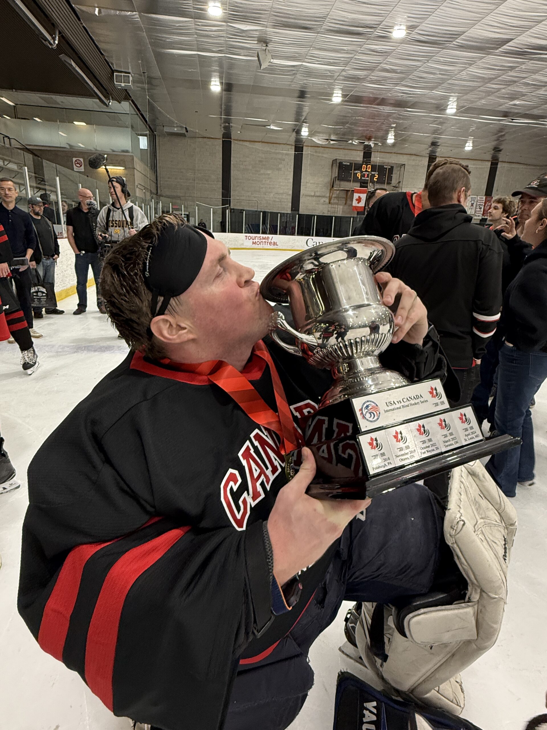 lorne kisses the courage cup after winning in montreal