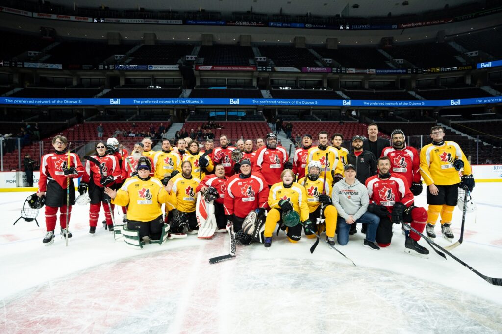 group photo of both teams on ice
